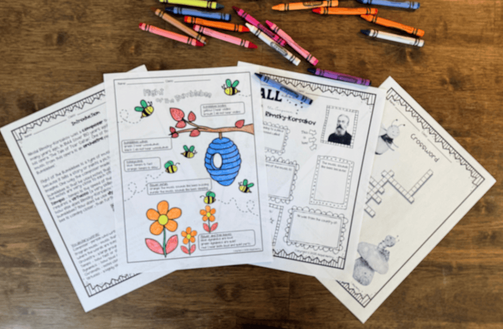 A collection of colorful, educational worksheets featuring illustrations of bees, flowers, and a beehive, placed on a wooden table with colorful crayons scattered around.